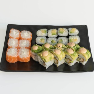 Japanese culinary Still Life. Californias with salmon, tuna, avocado and rice